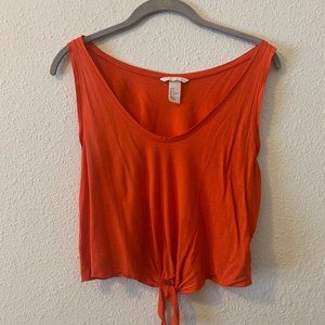 Burnt adobe red crop top w/knot at bottom.